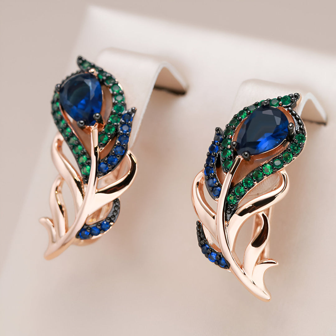 Boucles d'oreilles plumes de paon en or rose 18 Carats avec Shappires